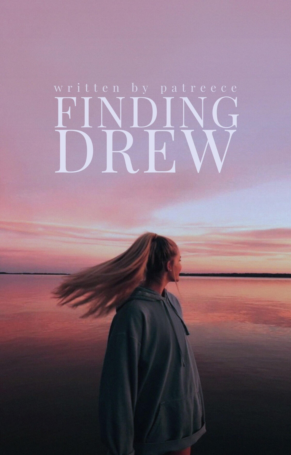 a blonde haired girl looks out at sea as the sun sets, creating a warm pink sky.